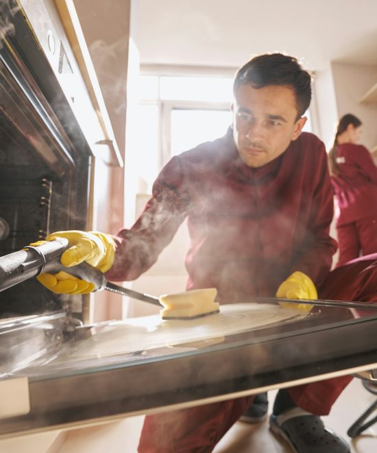 Professional janitorial personnel doing eco-friendly kitchen cleaning